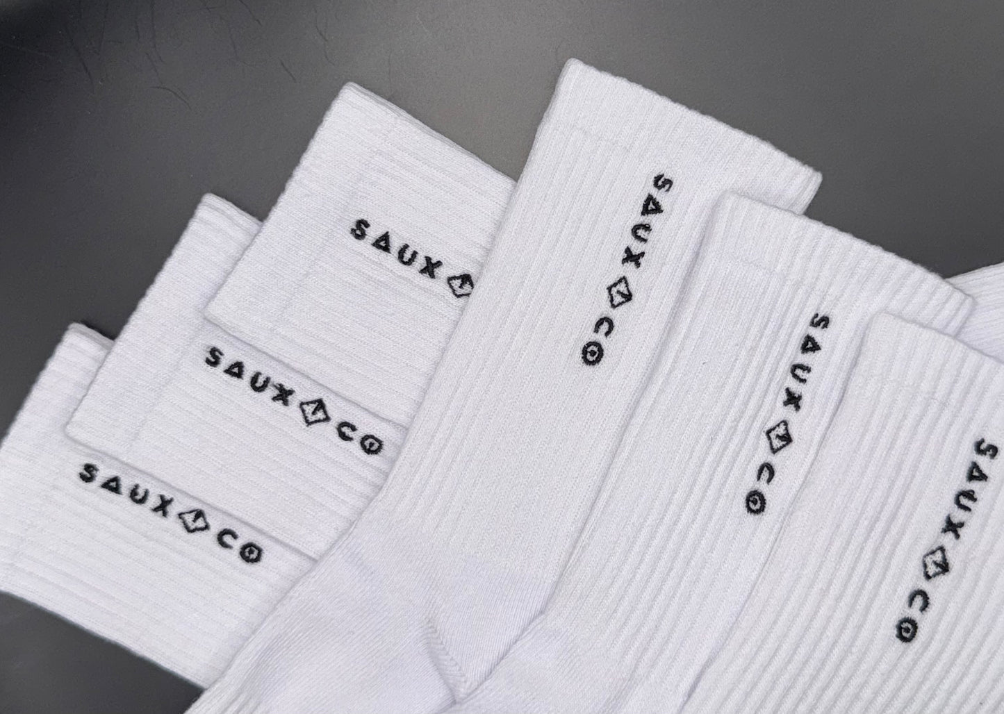 6 pairs of white crew socks flat lay photo showing full product